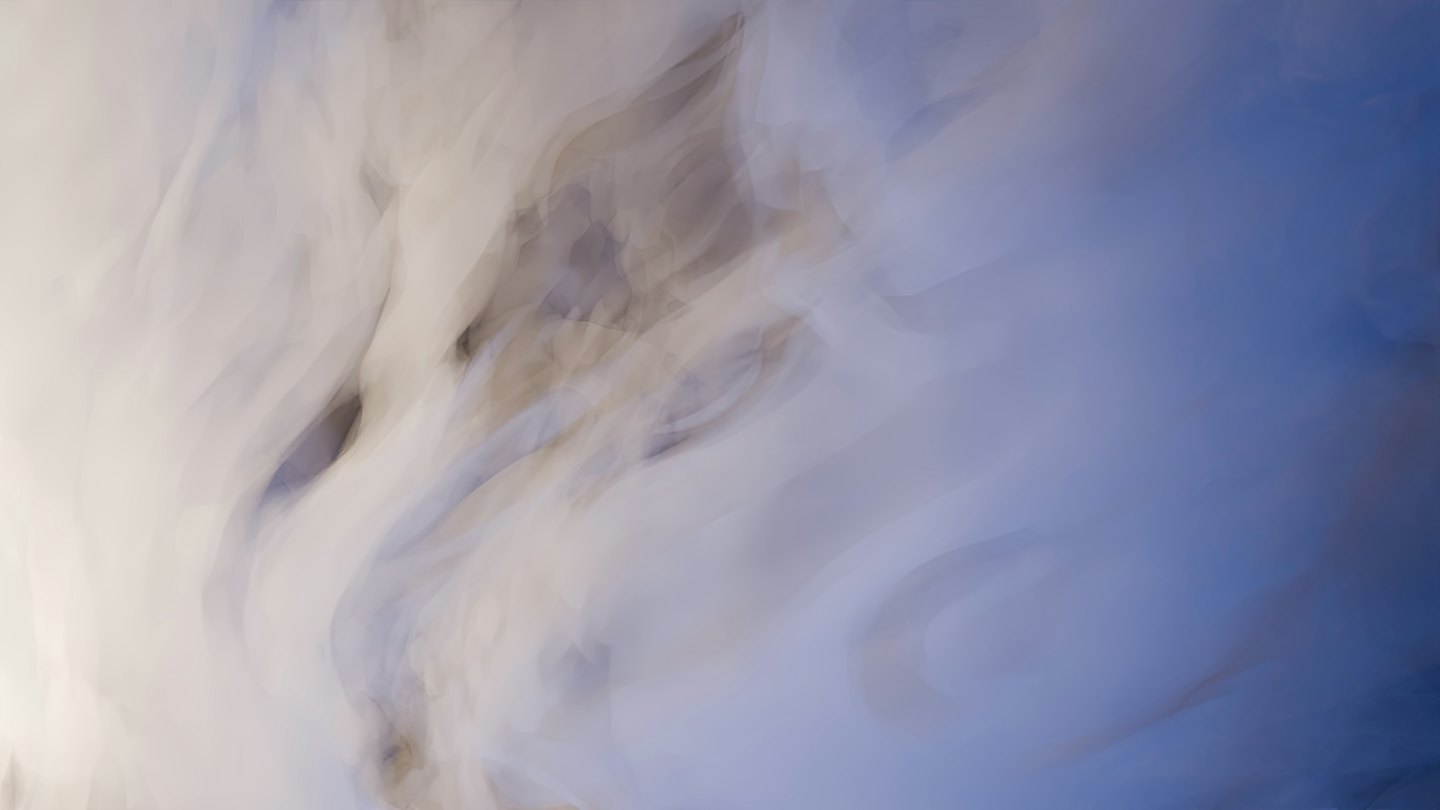 Soft swirling waves of beige, brown, and dusty blue.